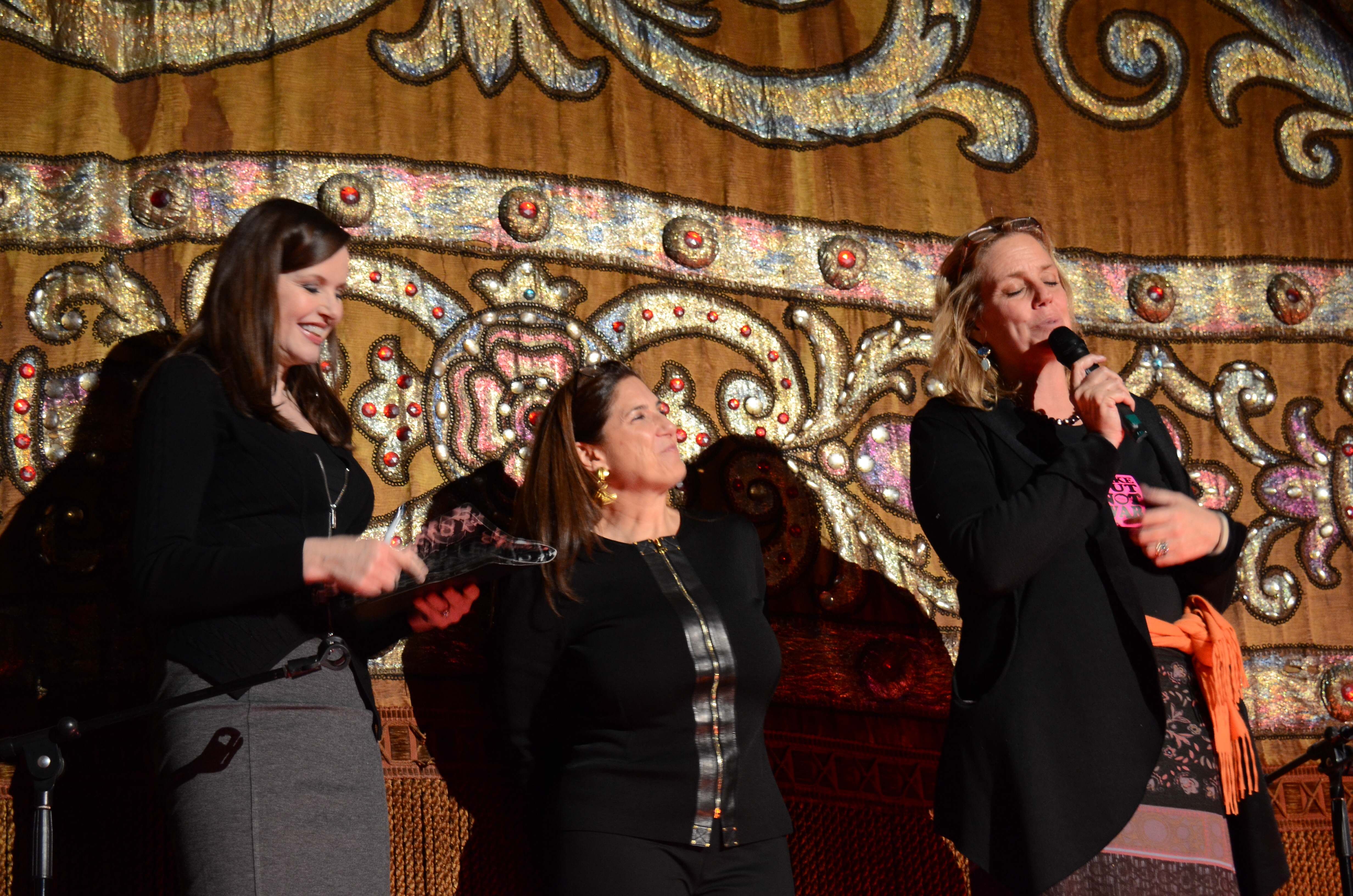 Geena Davis on stage with Regina K Scully & Geralyn Dreyfous